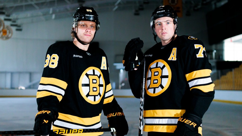 Boston Bruins forward David Pastrnak and defenseman Charlie McAvoy